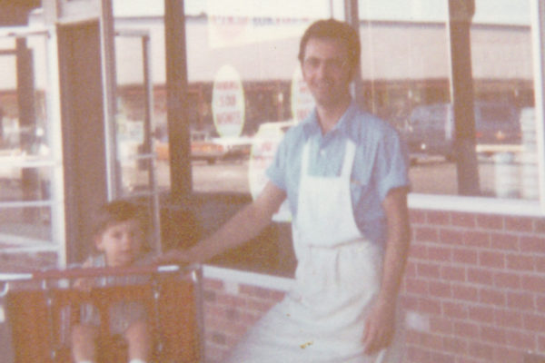 Sergio at the original Sergio's Pizza with his son